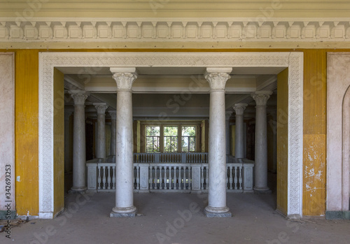 Hall with columns in the old abandoned manor