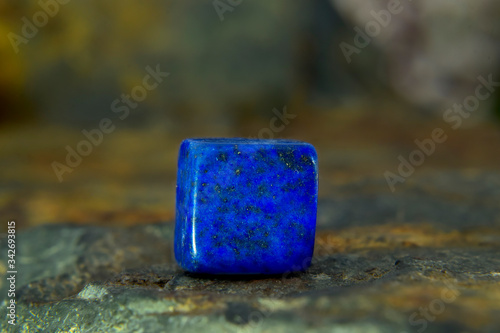  Lapis Is a beautiful natural gemstone on a wooden floor