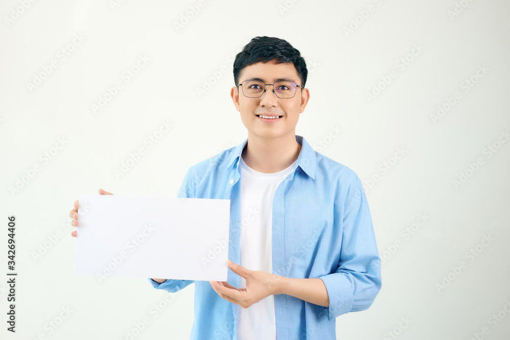 Asian young man showing pannel isolated on white background. Asian young man showing pannel isolated on white background.