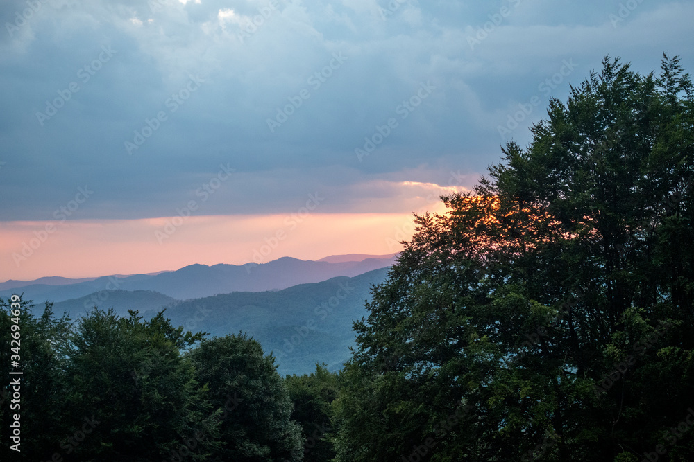 Fototapeta premium Beautiful sunset near forest in Suior area, Romania, spring cold day