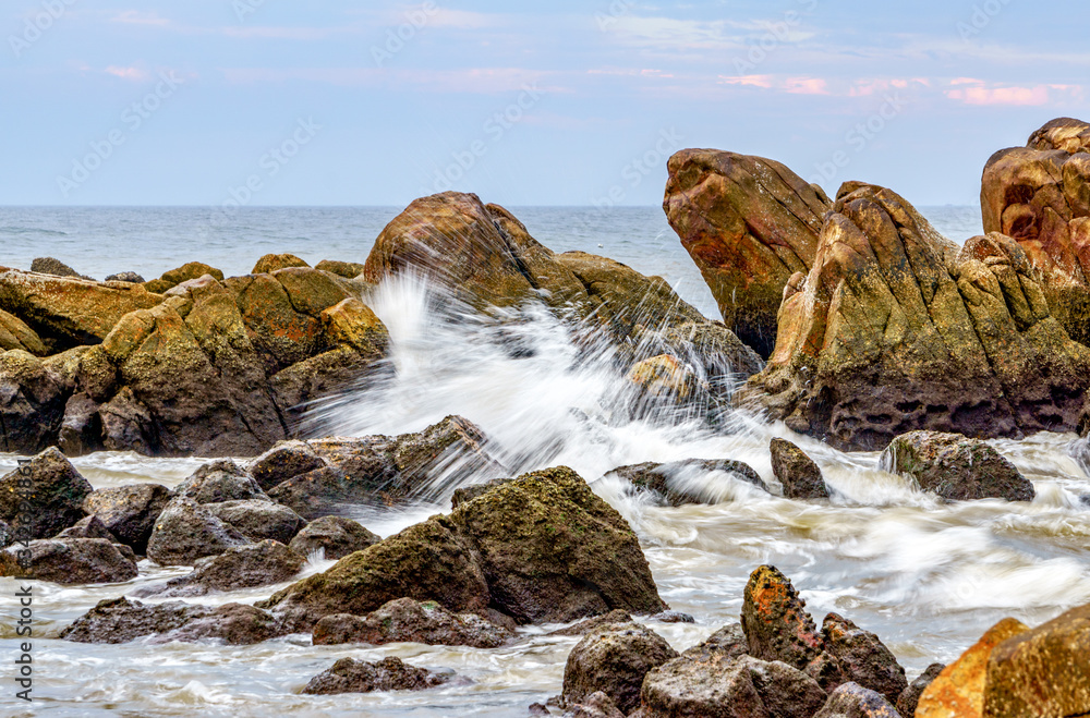Stone in sea with wave at Mui Ne, Phan Thiet, Binh Thuan, Vietnam