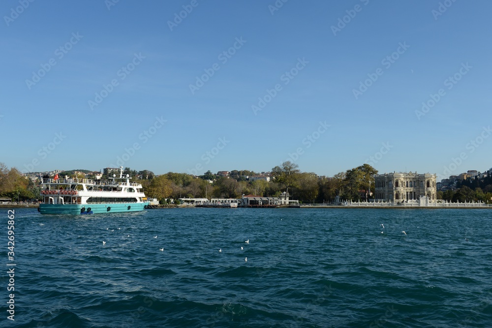 Passenger pleasure boat approaches the marina of Kucuk Shehir Khatlara Iskalesi in the Bosphorus Strait on the Asian side of Istanbul