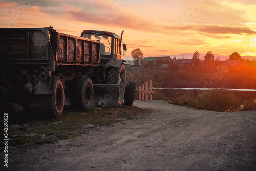 tractor on the road in sunset light