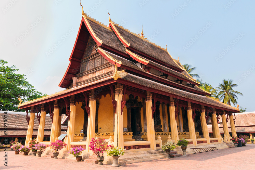 Naklejka premium Exterior of Buddhist wat Si Saket in Vientiane in Laos against blue sky