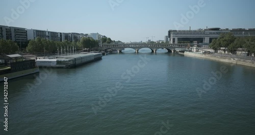 View on the Seine river from a bridge in Paris, and the metro lone summer