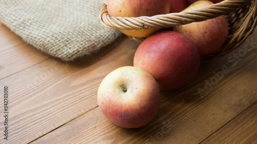 ripe apples on a wooden background