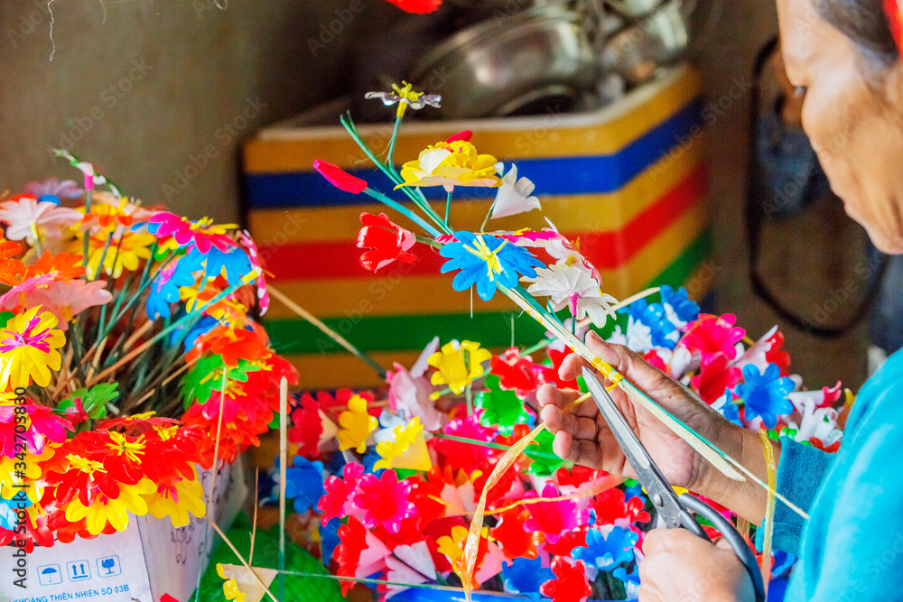 Fototapeta premium Flowers made of colored paper, in the Thanh Tien traditional village, Hue, Vietnam