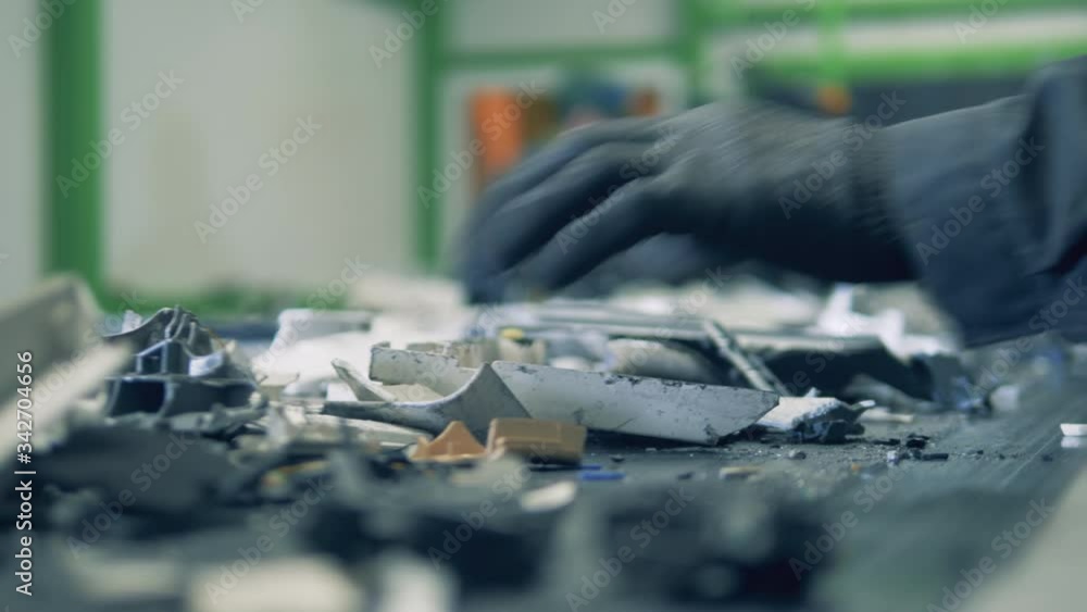 Electronics' debris are being arranged while moving along the belt Electronics' debris are being arranged while moving along the belt