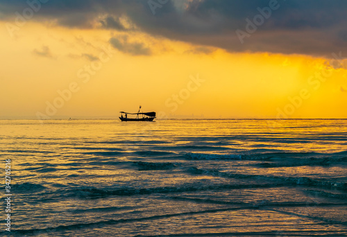 A boat in the sea with the sunset background at Koh Ta Kiev, Cambodia © Sondipon
