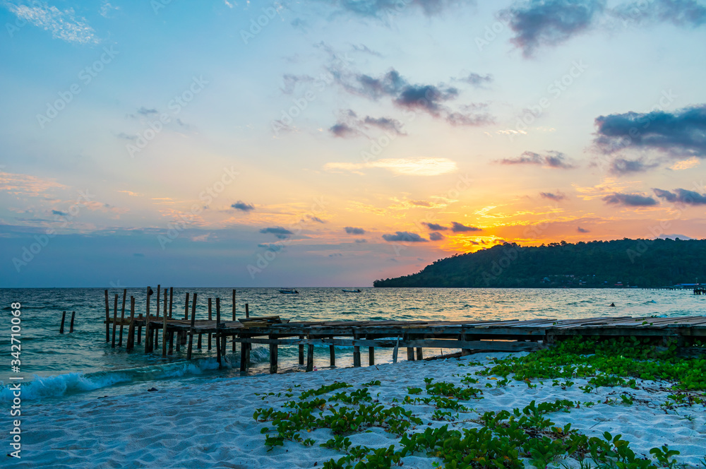 Sok San Beach, Koh Rong, Cambodia- Feb, 2020 : a wooden pier and a beautiful sunset from the Sok San Beach, Koh Rong, Cambodia