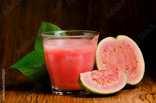 Obraz na plátně guava juice is served on a wooden background