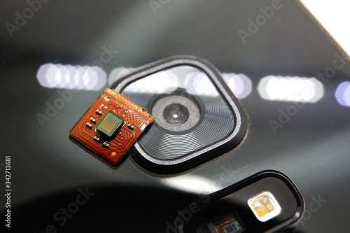 Smartphone image sensor detached with white background placed on smartphone camera