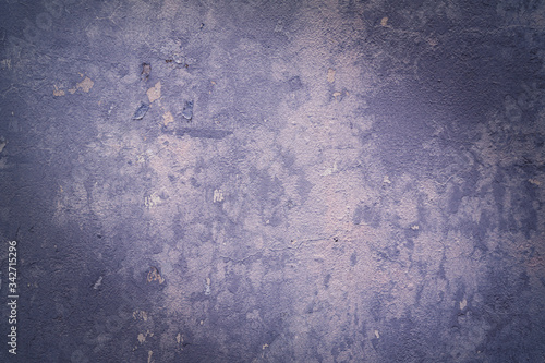 a concrete background with a rough texture and a little purple on an old surface.