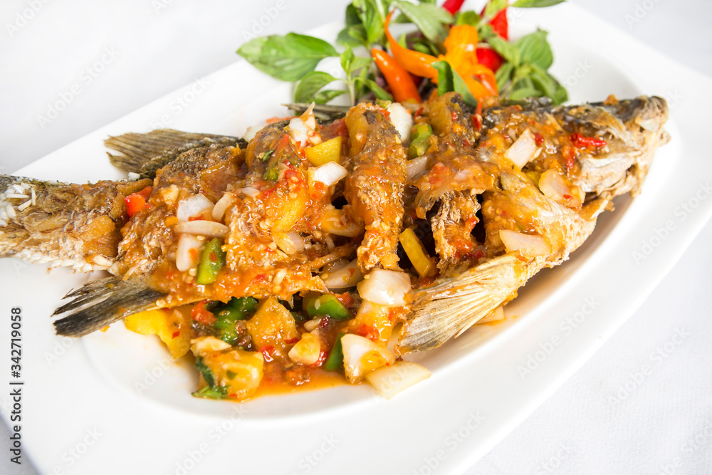 fired sea bass top with thai spicy sauce fired sea bass top with thai spicy sauce