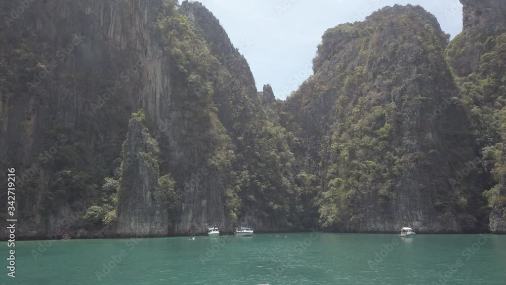 View of famous Phi Phi island in Thailand from a boat, entering the Bay, where the Beach movie was filmed. View of famous Phi Phi island in Thailand from a boat, entering the Bay, where the Beach movie was filmed.