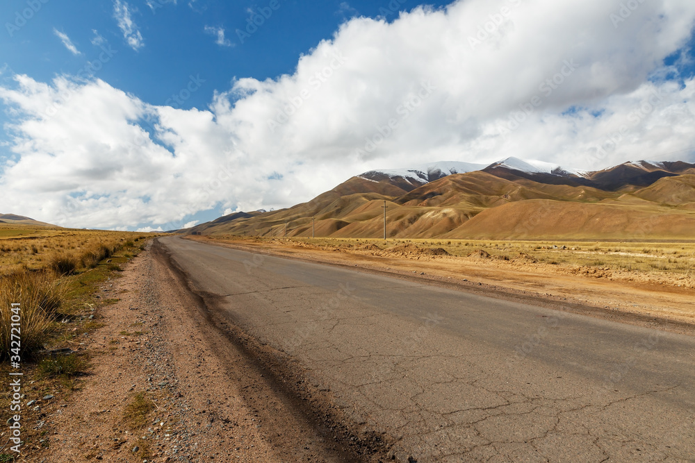A367 highway passing in the Naryn region of Kyrgyzstan, near the village of Uzunbulak in Kochkor District.