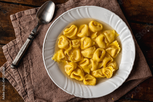 Cappelletti in brodo. Pasta italiana. Ravioli, tortellini photo