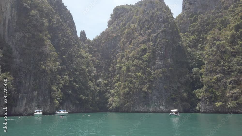 View of famous Phi Phi island in Thailand from a boat, entering the Bay, where the Beach movie was filmed. View of famous Phi Phi island in Thailand from a boat, entering the Bay, where the Beach movie was filmed.