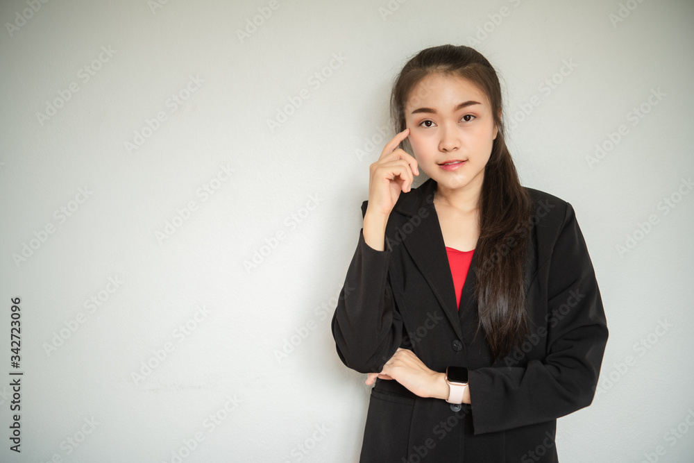 Portrait of young business woman working and thinking in the office. Portrait of young business woman working and thinking in the office.