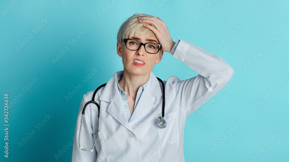 Problems in medicine. Upset woman doctor holding to head Problems in medicine. Upset woman doctor holding to head