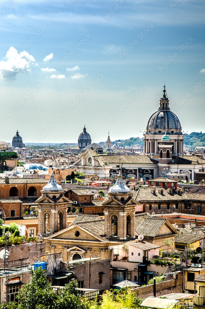 View of the sunlit city from one of the hills. Rome. Italy