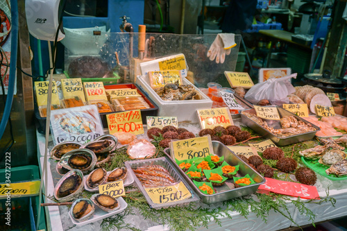 OSAKA, JAPAN, January 14, 2019 : Seafood display with a variety of seafood and affordable price front of retail store in Osaka fresh market.