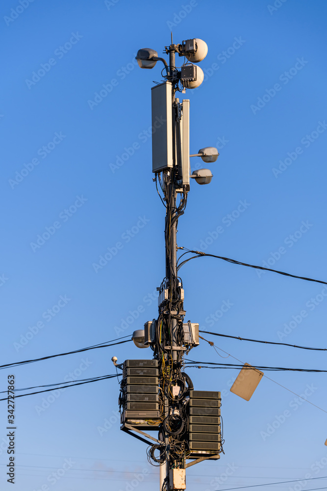 A post with telecommunications equipment. Equipment and cables for communication and Internet on the post. A post with telecommunications equipment. Equipment and cables for communication and Internet on the post.