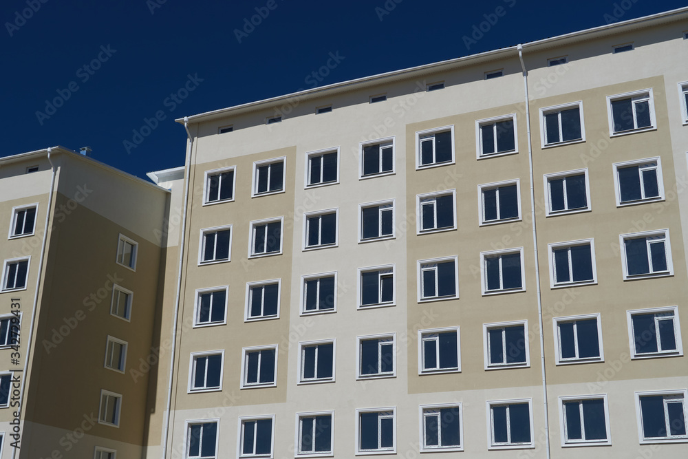 facade of a new multi-storey building with many windows