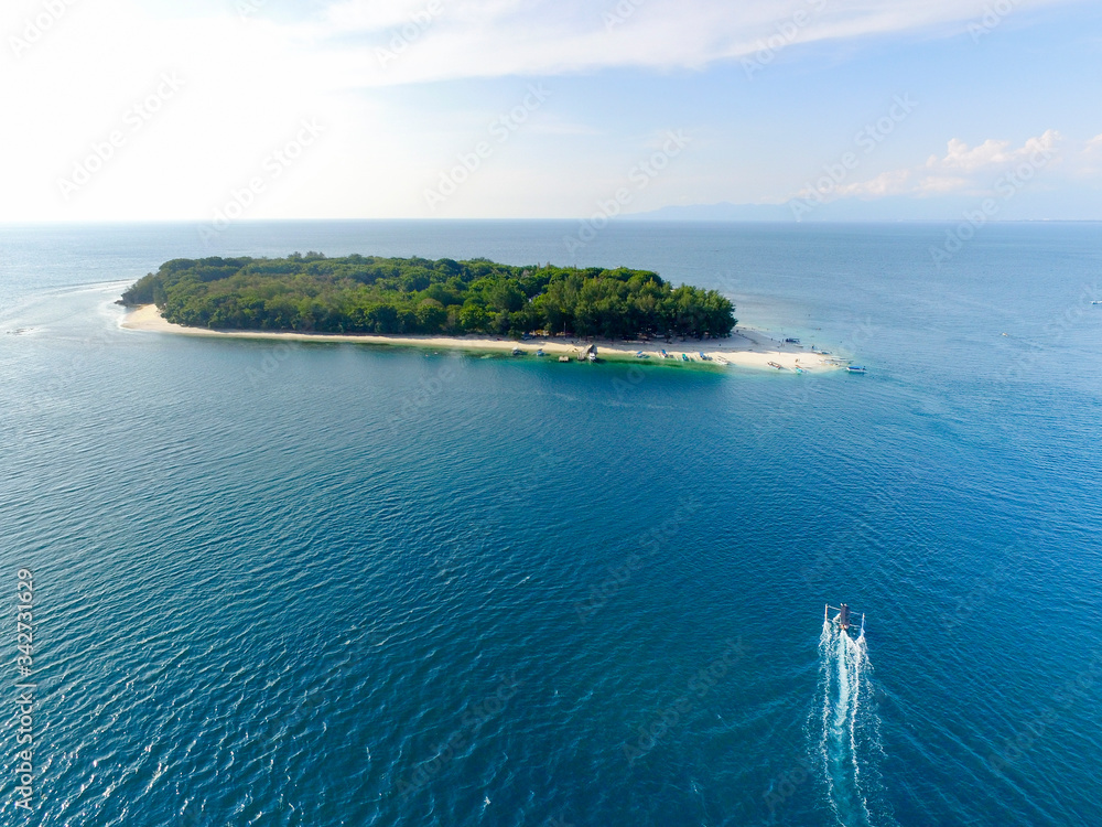 Lombok Indonesia, 4 July 2020: Boats at sea parking in Gili Trawangan Island.  Aerial view of Gili Trawangan
