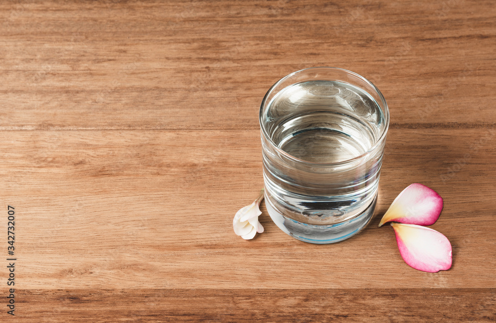 Water glass on wooden table. Glass and clean drinking water with copy space. Water glass on wooden table. Glass and clean drinking water with copy space.