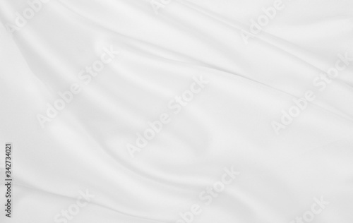 Smooth elegant white silk or satin luxury cloth texture as wedding background. Luxurious background design