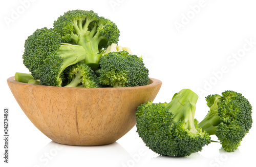 fresh broccoli healthy fresh vegetable from nature isolated on a white background .  wooden bowls.
