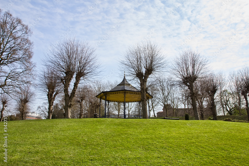 Empty Colchester Castle Park in England during lockdown in April 2020 due to coronavirus quarantine with bandstand and castle in the background. Empty Colchester Castle Park in England during lockdown in April 2020 due to coronavirus quarantine with bandstand and castle in the background.