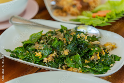 Popular dish in Southern of Thailand, Stir-fried Malindjo leaves with Egg.