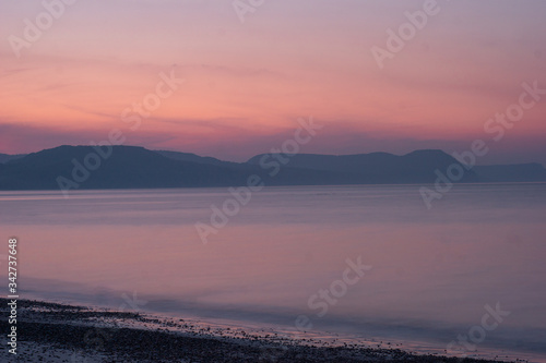 Fototapeta Naklejka Na Ścianę i Meble -  soft sun rising over the sea front
