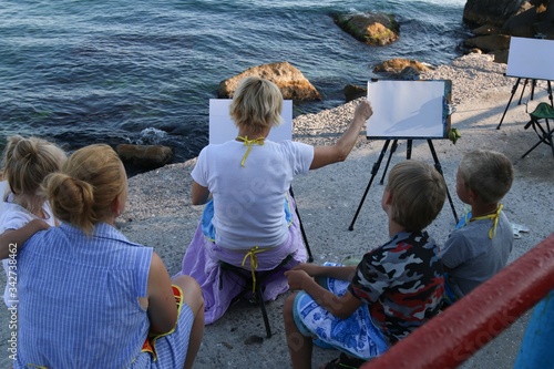 Group of artists on the beach