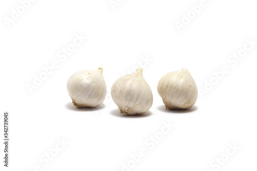 Three solo garlics isolated on white background