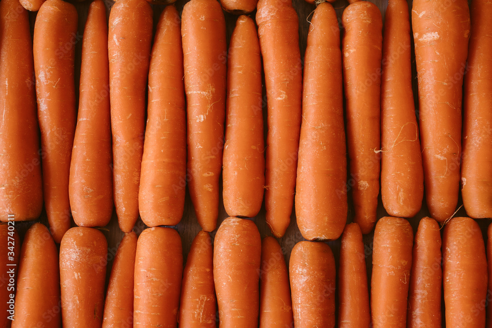 Organic carrots as texture and background. Top view. Organic and healthy food. Organic carrots as texture and background. Top view. Organic and healthy food.