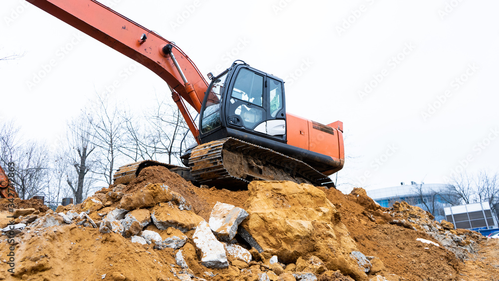 Construction, fittings, excavator, workers in suits, fastening fittings