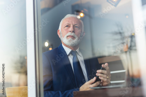 Senior businessman using smart phone