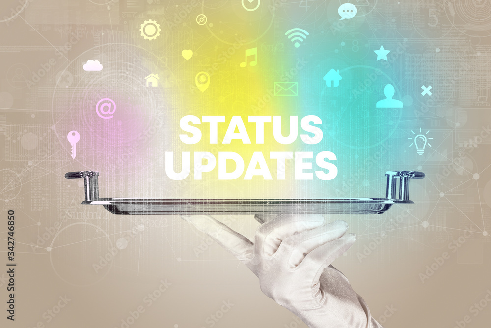 Waiter serving social networking with STATUS UPDATES inscription, new media concept Waiter serving social networking with STATUS UPDATES inscription, new media concept