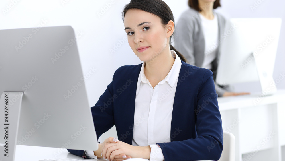 Businesswoman working with computer in office. Lawyer or accountant sitting at work, headshot. Business concept Businesswoman working with computer in office. Lawyer or accountant sitting at work, headshot. Business concept