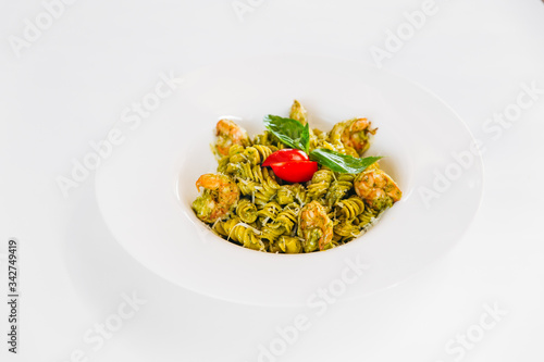 Italian dish green fusilli pasta with shrimps
