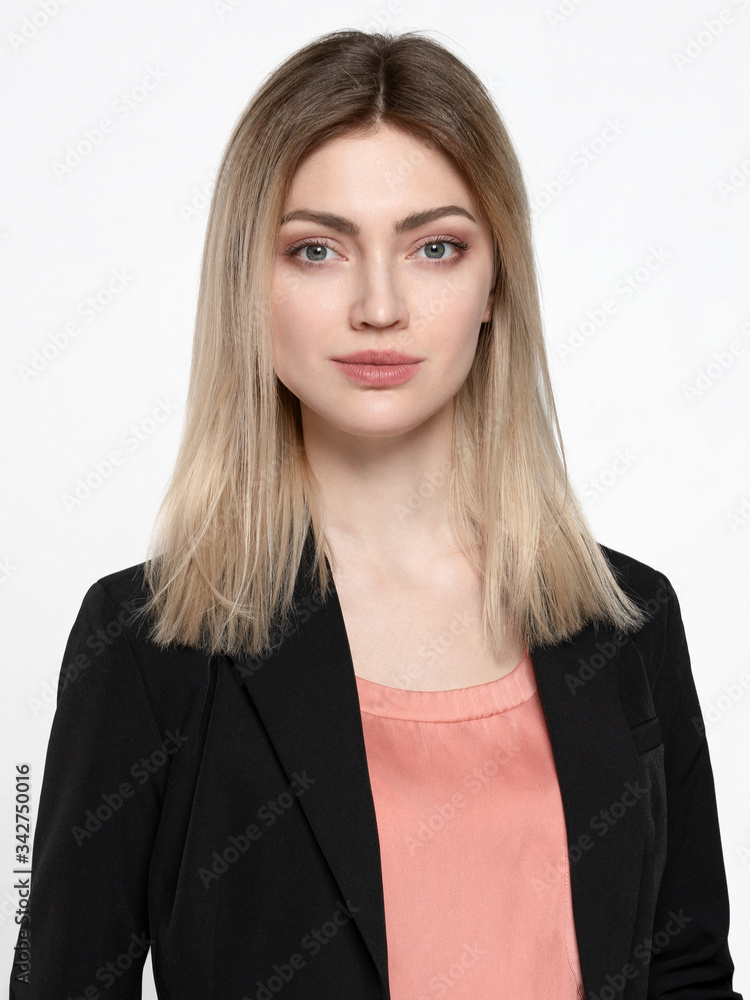 Blonde girl in a black jacket on a white background Blonde girl in a black jacket on a white background