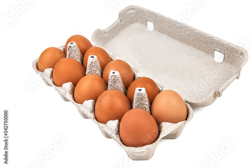 eggs in a paper tray on white