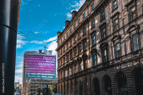 Canvas Print A view of a Glasgow street in front of a tall building