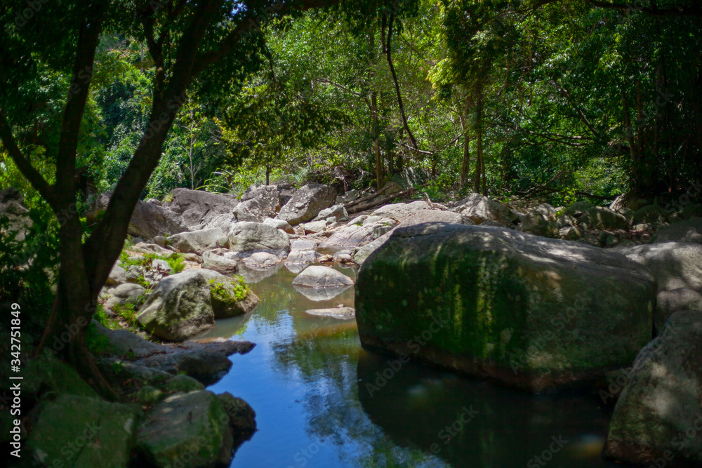 Mountain river in a rocky gorge in Thailand on Samui island. Mountain river in a rocky gorge in Thailand on Samui island.