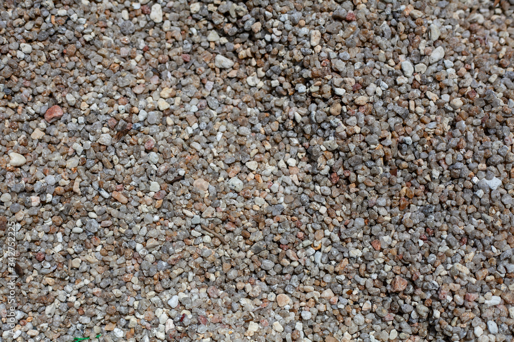 Natural background with fine brown and gray pebbles on the beach. Natural background with fine brown and gray pebbles on the beach.