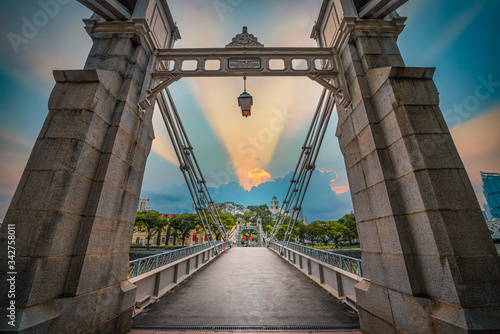 Canvas Print Cavenagh Bridge over singapore river at sunset in Singapore.