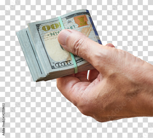 Man hand holding a wad of 100 dollar bills tied with rubber band on isolated background. Shallow dept of field. Including clipping path.